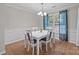 Charming dining area featuring wainscoting, a chandelier, and lots of natural light at 1445 Deer Forest Dr, Indian Land, SC 29707
