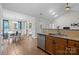 Open floor plan with kitchen showcasing granite countertops and stainless steel appliances at 1445 Deer Forest Dr, Indian Land, SC 29707