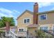 This exterior view of the back shows a wooden deck and chimney at 1670 Robins Nest Ct # C, Gastonia, NC 28054