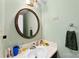 Small bathroom features a unique round mirror, light green walls, and a towel rack at 1670 Robins Nest Ct # C, Gastonia, NC 28054
