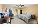 Bedroom with carpet, ceiling fan, closet, desk, and neutral colored walls at 1670 Robins Nest Ct # C, Gastonia, NC 28054
