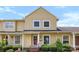 Charming yellow two-story home with well-maintained landscaping and a welcoming front porch at 1670 Robins Nest Ct # C, Gastonia, NC 28054