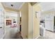 Hallway that connects living room with fireplace and kitchen with white appliances at 1670 Robins Nest Ct # C, Gastonia, NC 28054
