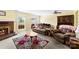 Comfortable living room with a brick fireplace, floral rug and a ceiling fan at 1670 Robins Nest Ct # C, Gastonia, NC 28054