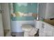 Bathroom with toilet, vanity, damaged wall, and dated tile floor needing renovation at 1672 Riverview Rd, Lincolnton, NC 28092