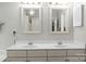 Bathroom with a double sink vanity and two large mirrors at 171 Highland Woods Ct, Denver, NC 28037