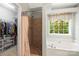 Bathroom with a shower, bathtub, and walk-in closet at 171 Highland Woods Ct, Denver, NC 28037