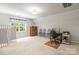 Spacious bonus room offers ample space, natural light, and versatile layout, perfect for various activities at 171 Highland Woods Ct, Denver, NC 28037