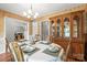 Dining room with china hutch and an open view to another room, perfect for entertaining at 171 Highland Woods Ct, Denver, NC 28037
