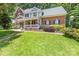 Charming two-story brick home with a welcoming front porch and well-manicured lawn at 171 Highland Woods Ct, Denver, NC 28037
