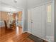 Bright foyer with hardwood floors leading to a formal dining room at 171 Highland Woods Ct, Denver, NC 28037
