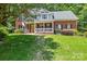 Charming two-story brick home with a welcoming front porch and manicured lawn at 171 Highland Woods Ct, Denver, NC 28037