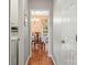 Hallway view into the dining room and includes the laundry area at 171 Highland Woods Ct, Denver, NC 28037