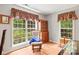Bright living room with large windows, built-in storage, and comfortable seating, perfect for relaxation at 171 Highland Woods Ct, Denver, NC 28037
