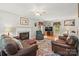 Spacious living room features a fireplace, comfortable seating, and natural light, creating a relaxing atmosphere at 171 Highland Woods Ct, Denver, NC 28037