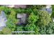 Aerial shot of a house surrounded by trees, showcasing the property's spacious lot and mature landscape at 1748 4Th Street Ne Ct, Hickory, NC 28601