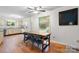Eat-in kitchen with laminate flooring, granite counters, an eat-in kitchen table, and plenty of natural light at 1748 4Th Street Ne Ct, Hickory, NC 28601