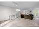 Bright living room features neutral tones, carpet, and natural light creating a warm and inviting atmosphere at 1748 4Th Street Ne Ct, Hickory, NC 28601