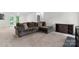 Cozy living room features neutral carpet, dark brown sofa, and stylish decor at 1748 4Th Street Ne Ct, Hickory, NC 28601
