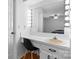 Bright vanity with expansive mirror and Hollywood lights, provides a functional and stylish space at 1748 4Th Street Ne Ct, Hickory, NC 28601