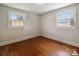 Hardwood floor bedroom with two windows and trim and a neutral wall color at 1787 Eastover Dr, Mount Pleasant, NC 28124