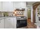 Cozy kitchen showcases stainless steel appliances, granite countertops and wooden accents creating a warm atmosphere at 1787 Eastover Dr, Mount Pleasant, NC 28124