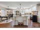 Bright kitchen with a large granite island, stainless steel appliances, and pendant lighting at 1787 Eastover Dr, Mount Pleasant, NC 28124