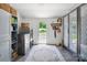 Practical laundry room with updated appliances, storage cabinets and outdoor access to the backyard at 1787 Eastover Dr, Mount Pleasant, NC 28124