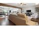 Open-concept living room flowing into a kitchen with hardwood floors and a beamed ceiling at 1787 Eastover Dr, Mount Pleasant, NC 28124
