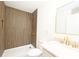 Modern bathroom showcasing wood paneled shower, sleek vanity, and contemporary fixtures at 1810 Highway 55 W Hwy, Clover, SC 29710