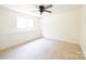 Neutral-toned bedroom with a ceiling fan and natural light from one window at 1810 Highway 55 W Hwy, Clover, SC 29710