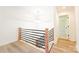 Upstairs hallway with modern railing and natural light provides access to rooms at 1810 Highway 55 W Hwy, Clover, SC 29710