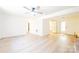 Spacious living room with light wood floors, a ceiling fan, and glass doors to the exterior at 1810 Highway 55 W Hwy, Clover, SC 29710