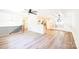 Open-concept living area with hardwood floors, modern railing, and abundant natural light at 1810 Highway 55 W Hwy, Clover, SC 29710