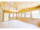 Bright sunroom with wood paneled walls, tiled floor and many windows at 1810 Highway 55 W Hwy, Clover, SC 29710