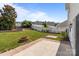 Spacious backyard with a well-maintained lawn, mature trees, and a charming fire pit at 1901 Summit Ridge Ln, Kannapolis, NC 28083