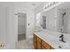 Bright bathroom with vanity, mirror, closet, toilet, and tiled floors, and a window with natural light at 1901 Summit Ridge Ln, Kannapolis, NC 28083