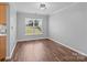 Spacious bedroom with laminate flooring, ample natural light, and neutral paint at 1901 Summit Ridge Ln, Kannapolis, NC 28083