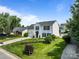 Charming two-story home with white siding, manicured lawn, and attractive landscaping at 1901 Summit Ridge Ln, Kannapolis, NC 28083