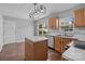 Bright kitchen with island, stainless steel appliances, and sliding glass door to the backyard at 1901 Summit Ridge Ln, Kannapolis, NC 28083
