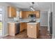 Well-equipped kitchen with stainless steel appliances, bright countertops, and a functional island at 1901 Summit Ridge Ln, Kannapolis, NC 28083