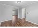 Bright living room with hardwood flooring and view to kitchen at 1901 Summit Ridge Ln, Kannapolis, NC 28083