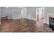 Open-concept living room with hardwood floors, ample space, and seamless transitions to other areas at 1901 Summit Ridge Ln, Kannapolis, NC 28083