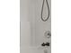 An up close view of a shower with white tiled walls and an oil rubbed bronze faucet at 1901 Summit Ridge Ln, Kannapolis, NC 28083