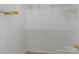 A walk-in closet with hanging metal shelving and neutral carpet at 1901 Summit Ridge Ln, Kannapolis, NC 28083