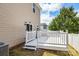 Cozy back deck with white railings and stairs leading to yard, perfect for relaxation at 2005 Amos Oaks Ln, Charlotte, NC 28215