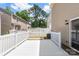 Spacious white back deck perfect for outdoor entertaining, overlooks backyard and neighborhood at 2005 Amos Oaks Ln, Charlotte, NC 28215