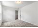 Carpeted bedroom with white walls and an open doorway offers a spacious and inviting atmosphere at 2005 Amos Oaks Ln, Charlotte, NC 28215