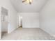 Bedroom with vaulted ceilings, ceiling fan, carpeted floors and multiple closets at 2005 Amos Oaks Ln, Charlotte, NC 28215
