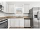 Bright kitchen features stainless steel appliances, granite countertops, and white cabinetry at 2005 Amos Oaks Ln, Charlotte, NC 28215